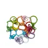 Venta al por mayor del fabricante Llavero colorido con forma de D de aleación de zinc pintado con diseño de ocho, Llavero de accesorios de joyería hechos a mano para DIY
