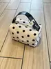Bolso de lunares nuevo 2026, bolsa de lona versátil para mujer, adecuado para ir al trabajo, bolso de hombro, bolso de mano, bolso de cosméticos de nicho para mujer, portátil