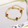 Pulsera de doble capa de cuatro hojas más vendida transfronteriza para mujer, estilo coreano personalizado, fresca, simple, dulce, linda, de acero inoxidable, moderna para el trabajo