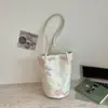 Nuevo bolso de mano de encaje estilo chino para mujer, nuevo bolso de hombro de moda de verano 2026, bolso tipo cubo de gran capacidad