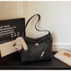 Bolso Versátil de Nicho para Mujer 2025 Nuevo Modelo Textura de Alta Calidad Bolso de Hombro Cruzado Súper Popular Bolso Tote de Gran Capacidad para el Trabajo