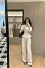 Nuevo estilo de moda con cuello relajado, suéter de punto ajustado y pantalones de pierna ancha, conjunto de dos piezas en gris y negro