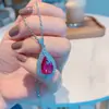 Anillo de corindón rojo de simulación Pendientes colgante collar de moda popular europea y americana Juego de pendientes de corindón rojo de imitación