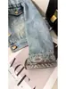 Jaqueta Jeans Feminina Retrô de Manga Longa Nova para a Primavera de 2026 Curta Fashion Lavada Vintage Lapela Emagrecedora