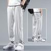 Pantalones de Hombre Verano Seda de Hielo Caída Casual Pantalones de Hombre Estudiantes Modernos Pierna Ancha Talla Grande Elásticos Deportivos Pantalones Cortos