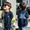 Camiseta de Algodão Puro com Listras e Manga Longa para Meninos Camada Base Roupa Íntima Infantil Tamanho Médio a Grande Camiseta Top para Usar por Cima Estilo Novo Primavera/Outono 2026