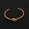 [18] Anillo Retorcido de Amantes para Hombres y Mujeres Corea del Sur Ins Simple Estilo Frío Nudo Retro Anillo para el Dedo