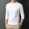 Camiseta de manga larga para hombre, adecuada para primavera y otoño, corte holgado, cuello redondo, capa interior fina, base elástica, versátil y moderna