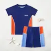 Nuevo traje de baño infantil transfronterizo, traje de baño de dos piezas con protección solar y bonitos estampados de dibujos animados, cómodo para jugar en el agua y en la playa