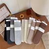 Calcetines apilados de algodón peinado para niños, otoño e invierno, nuevos calcetines de longitud media, calcetines rectos de color liso, calcetines largos verticales casuales que combinan con todo.