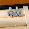 Aretes de Aguja Plateada con Incrustaciones de Diamante, Diseño Redondo Hueco, Serie Azul, Aretes de Moda y Versátiles con un Toque de Lujo Ligero y de Alta Gama para Mujer