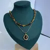 Moda Retro Francesa Simple Collar de Piedra Ojo de Tigre Nuevo de Moda Celebridad de Internet Estilo Popular Exquisita Cadena Minimalista para Clavícula para Mujeres