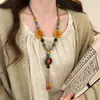 Nuevo collar vintage de cuentas florales estilo chino para mujer, cadena larga de borlas estilo étnico para suéter, accesorio de alta gama