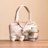 Juego de té de viaje kung fu de flor de durazno de fábrica traje para exteriores anti-caliente mano té taza rápida una tetera dos tazas bolsa portátil