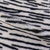 En Stock Polié Multicolor Estampado Patrón Cebra Pelo de Conejo Tejido de Punto Estampado Tela de Felpa de Pelo de Conejo para Pantuflas