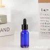 Botella de Vidrio Azul para Aceite Esencial al por Mayor 20ml Botella de Esencia 30ml Botella con Gotero de Punta de Spray Plástica a Prueba de Luz