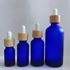 Botella de vidrio esmerilado color té para aceite esencial, tapa de madera de bambú, botella con gotero, submuestra de cosméticos, botella de vidrio, botella para dilución de aceite esencial, venta al por mayor