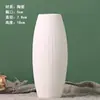 Una generación de jarrón de cerámica para quemar pigmento blanco al por mayor para plantar agua, adornos de flores secas, puesto de suministro, outlet de fábrica