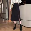 Falda midi para mujer, nueva colección de primavera 2026, con un elegante diseño francés, cintura alta, abertura y una silueta A negra que acentúa las caderas.