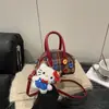 Bolsa Infantil Otoño e Invierno Nueva Estilo Coreano Bolso de Mano Cuadros Rojos Bolso Cruzado Familiar de Bowling de Alta Gama Billetera