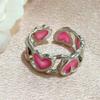 Viento frío corazón rosa anillo luminoso hueco femenino nicho retro diseño sentimiento rojo de internet anillo abierto al por mayor