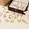 Set de Cuatro Piezas de Trébol de Cuatro Hojas de Doble Cara Más Vendido Transfronterizo: Collar, Aretes, Pulsera, Anillo, Conjunto de Joyería Versátil y Elegante de Cinco Hojas