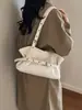 Bolso de axila para mujer estilo francés de nicho para el día a día, nuevo bolso de hombro simple de moda 2026, bolso tote de alta gama exquisito