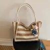 Bolso de mano tejido a rayas de moda transfronterizo 2026 nuevo versátil para el trabajo bolsa grande estilo coreano de gran capacidad para mujer