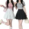 2026 Nuevo Estilo Cintura Alta Adelgazante Moda Dulce Versátil Negro y Blanco Anti-Exposición Falda Abullonada para Estudiantes