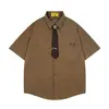 Jia Yi Ku 2026 Verano Nuevo Estilo Vintage Americano Camisa de Pana con Corbata Ropa Casual de Negocios Camisa para Hombre
