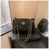 Nuevo bolso de hombro con cadena de patrón de diamantes de moda transfronterizo de comercio exterior para mujer, un bolso de nicho elegante y de alta gama para el día a día que se puede llevar debajo del brazo o en la mano.