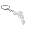 Liga de zinco estimulação campo de batalha deserto águia pistola adereços comendo frango chaveiro mini pistola modelo pingente