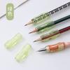 Corrector de agarre de lápiz para niños corrección postura al escribir estudiante niño pequeño funda de silicona color caramelo