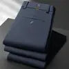 Pantalones casuales de negocios para hombre de otoño e invierno, de cintura alta, pierna recta, longitud media, elásticos, resistentes a las arrugas, pantalones de traje negros y azul oscuro