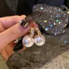 Pendientes de Perla de Circonita de Moda de Aguja Plateada Pendientes de Botón Retro de Lujo Ligero de Nicho Francés Pendientes Nuevos 2026
