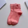 Calcetines navideños transfronterizos para mujer, calcetines de media pantorrilla para otoño e invierno, bordado de dibujos animados en colores caramelo, absorbentes de sudor, resistentes al olor, calcetines de algodón de color liso al por mayor