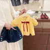 Conjunto Nuevo de Verano 2026 para Bebé Niña Estilo Coreano con Camisa de Muñeca con Lazo y Shorts de Mezclilla Conjunto de Dos Piezas Moderno