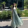 Vestido slip sin mangas de cuello halter en V para mujer, estilo francés de verano, puro y seductor, estilo vacacional en la playa, vestido largo transparente de línea A