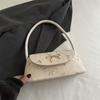Bolso de paja de estilo coreano, versátil y a la moda, para mujer, otoño 2024, nuevo, de gran valor, con lazo bordado en el hombro.