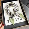Nuevo patrón floral estilo coreano bufanda larga estrecha de ángulo oblicuo estilo extranjero en stock moda decorativa bufanda banda para el cabello de doble propósito