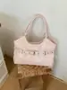 Bolso de mano casual de gran capacidad para mujer, nuevo y moderno de la primavera 2026, exquisito, de lujo ligero, para el hombro y cruzado diario