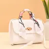 Bufanda de seda con rayas de diamante candado redondo bolso cuadrado pequeño 2026 estilo coreano bolso de mano pequeño comercio exterior al por mayor bolso de moda moderno