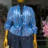 Moda Feminina Transfronteiriça Europeia e Americana Verão 2026 Novo Estiloso Design Listrado com Laço Blusa de Manga Longa