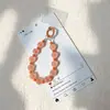 Nueva cadena para teléfono de cuentas esmeriladas transfronteriza, colgante para teléfono de cadena de cuentas de goma acrílica adecuado para bolsos y llaveros de coche