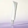 Tapa acrílica transparente punta de gota de agua tubo blando crema para ojos con niacinamida crema blanqueadora cosmético PE tubo blando fabricante personalizado