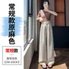 Foto real de los nuevos pantalones anchos de verano 2026 de Tencel y lino, pantalones casuales de cintura alta adelgazantes, pantalones rectos hasta el suelo de seda helada para mujer