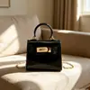 Mini bolsa Kelly brilhante para mulheres, bolsa de mão de couro envernizado de alta qualidade, bolsa de ombro e transversal com corrente requintada de luxo leve
