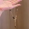 Exquisito Collar de Piedra Ojo de Tigre con Zirconia de Estrella y Luna Moda Otoño e Invierno Versátil para el Trabajo Cadena Larga para Clavícula Accesorios de Collar de Nicho Venta al por Mayor