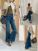 Otoño TOP estilo europeo Producto principal de las Trece Fábricas de Guangzhou: jeans de campana con dobladillo ondulado bordado de elasticidad en cuatro direcciones 13353
