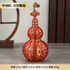 Adorno de calabaza de latón con el diseño de una botella llena de cientos de bendiciones, una pieza decorativa de la serie "Bendiciones de los Oficiales Celestiales"